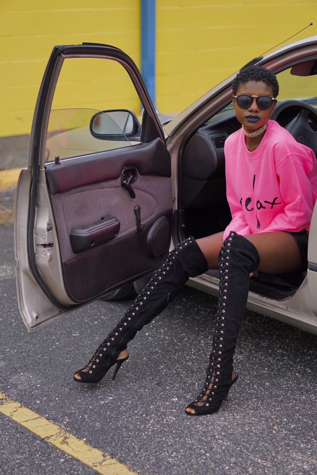 black lace up over the knee boots, hot pink sweat shirt, relax, edgy style