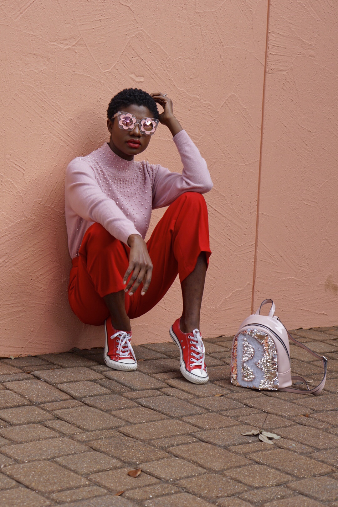 Valentines day outfit, red and pink, color blocking, pearl detail, short natural hair, sequins purse, red converse, flower sunglasses