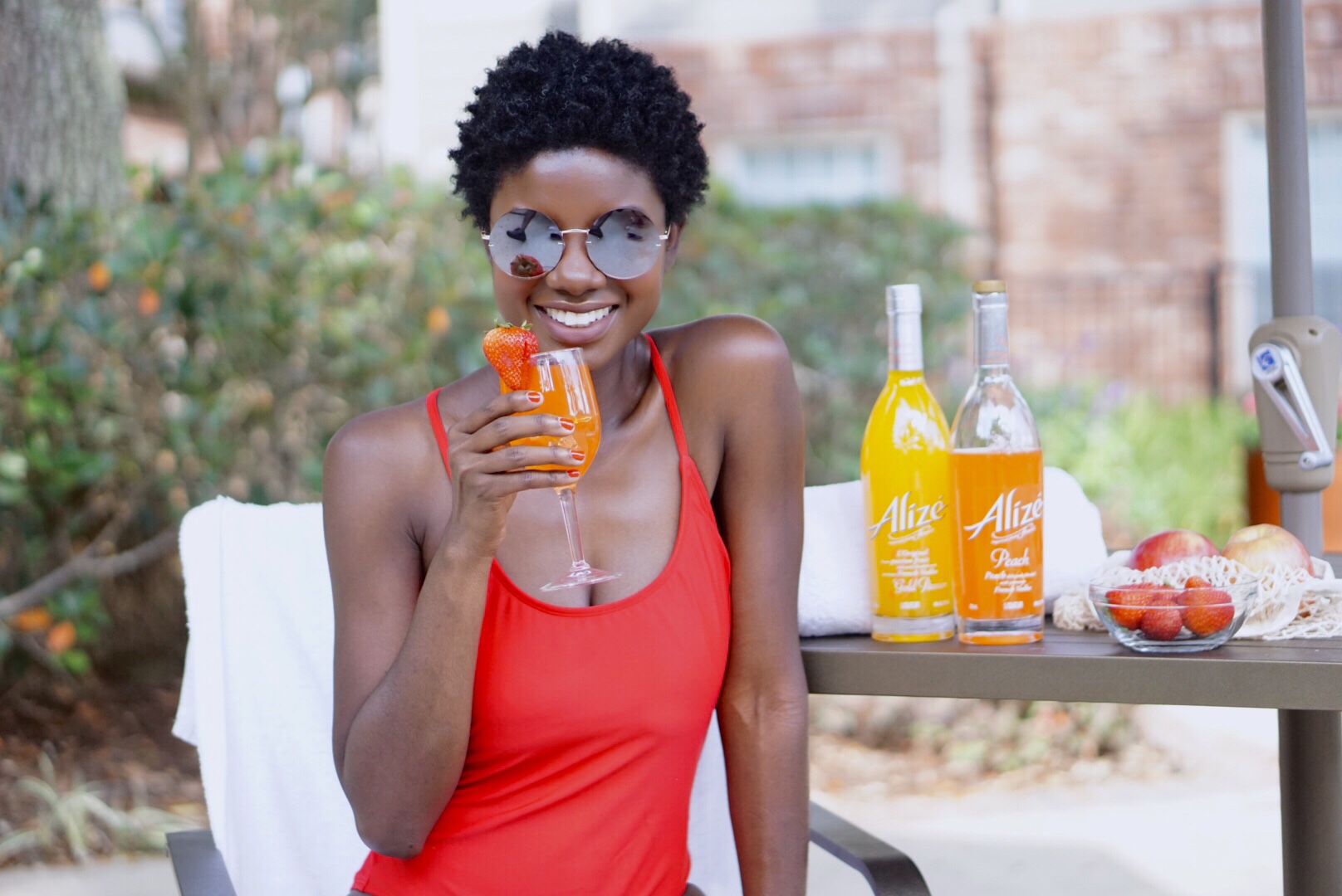 Summer Cocktails, easy summer cocktails, Alize, Alize recipes, fruity cocktails, fruity drinks, twa, dark skin girl, red swimsuit, short natural hair, pool side, relax by the pool, pool inspo, round sunglasses